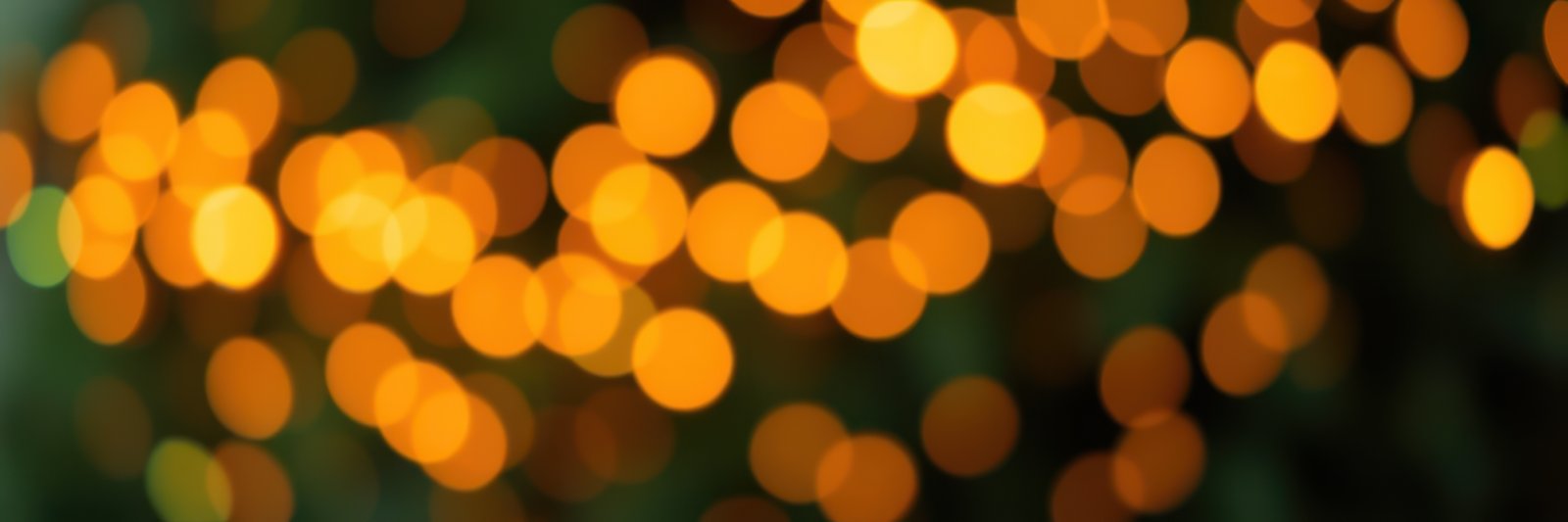 Warm golden bokeh lights creating a dreamy atmosphere in an evening gathering space